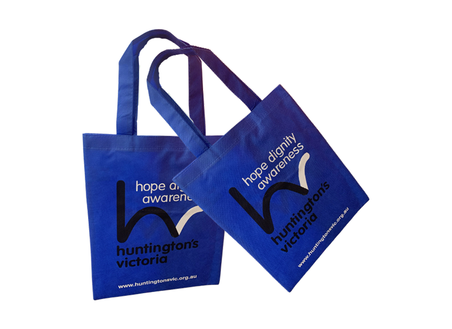 Woman walking through a gym entrance with a blue bag